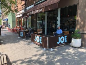 restaurant sidewalk cafe barriers outside Joe Coffee Company in NYC