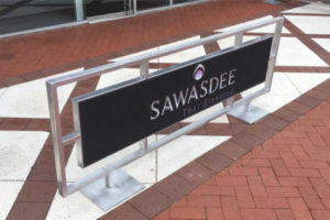 Sidewalk cafe barriers outside restaurant Sawasdee Thai Elevated